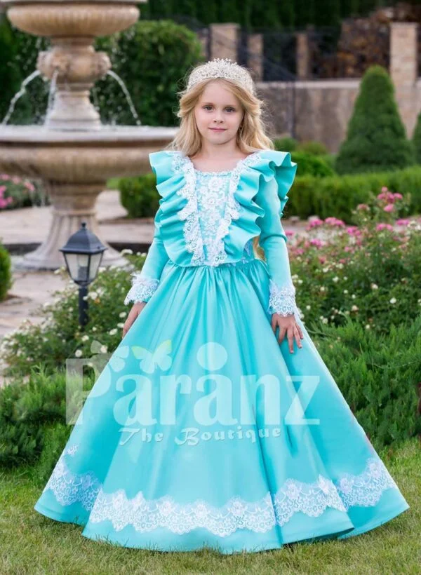 Rich satin sky blue baby gown with full sleeve and floor length tulle skirt underneath