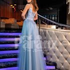 Sleeveless elegant blue evening gown with side slit tulle skirt and floral appliquéd royal bodice back side view