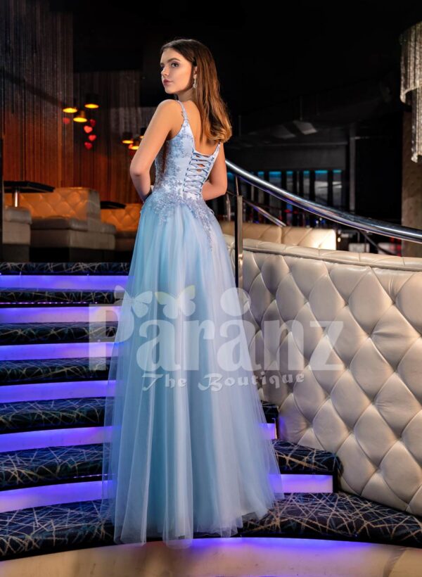 Sleeveless elegant blue evening gown with side slit tulle skirt and floral appliquéd royal bodice back side view