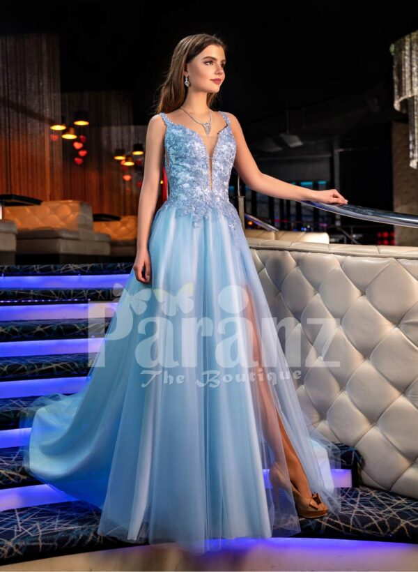 Sleeveless elegant blue evening gown with side slit tulle skirt & floral appliquéd royal bodice
