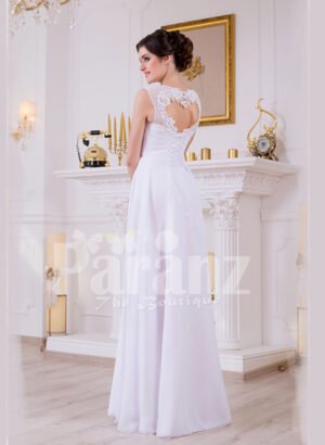 Sleeveless pearl white floor length tulle skirt wedding gown with lace appliquéd bodice back side view