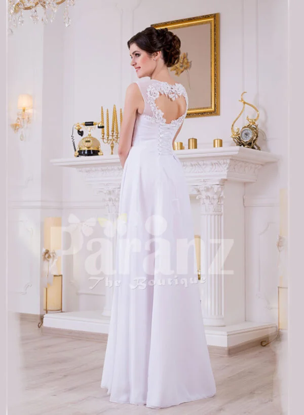 Sleeveless pearl white floor length tulle skirt wedding gown with lace appliquéd bodice back side view