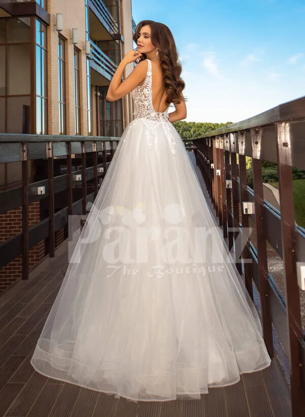 Sleeveless white lace work soft tulle wedding gown back side view