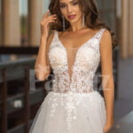 Sleeveless white lace work soft tulle wedding gown close view