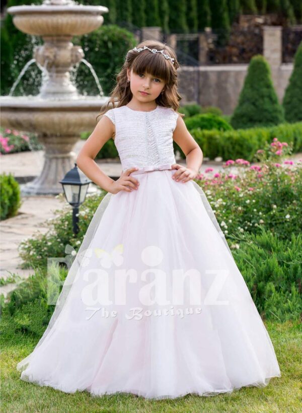 Small cap sleeve soft and lightweight light pink baby gown with flared tulle skirt