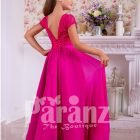 Soft and lightweight rich satin skirt and delicate lacework bodice party gown in fuchsia pink back side view
