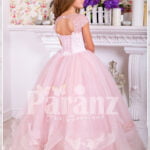 Soft creamy pink flared and high volume tulle skirt dress with pink floral work white bodice side view