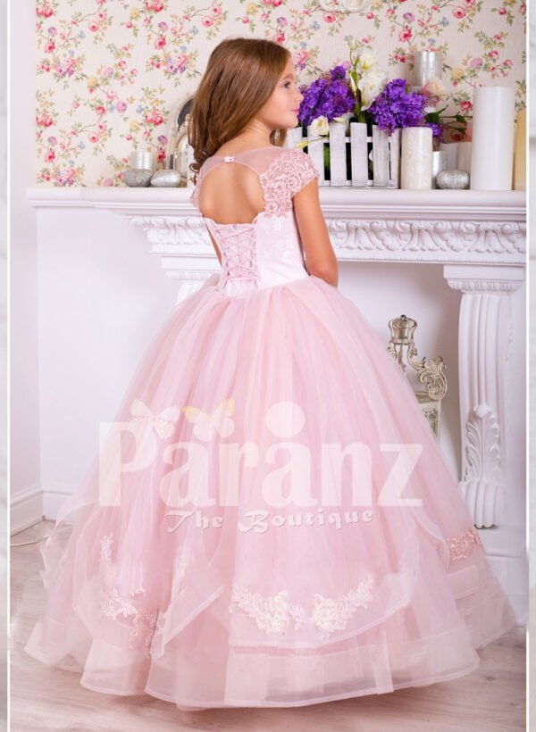 Soft creamy pink flared and high volume tulle skirt dress with pink floral work white bodice side view