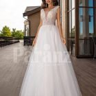 White floor length tulle wedding gown with glitz glam bodice