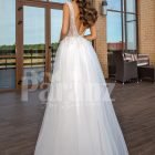 White floor length tulle wedding gown with glitz glam bodice back side view