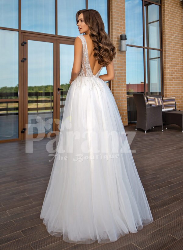 White floor length tulle wedding gown with glitz glam bodice back side view