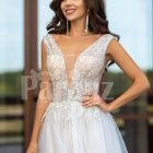 White floor length tulle wedding gown with glitz glam bodice close view