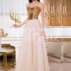 Women super stylish golden sequin bodice evening gown with long pink tulle skirt
