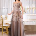 Womens exclusive evening gown with rich royal appliquéd bodice with floor length tulle skirt