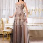 Womens exclusive evening gown with rich royal appliquéd bodice with floor length tulle skirt