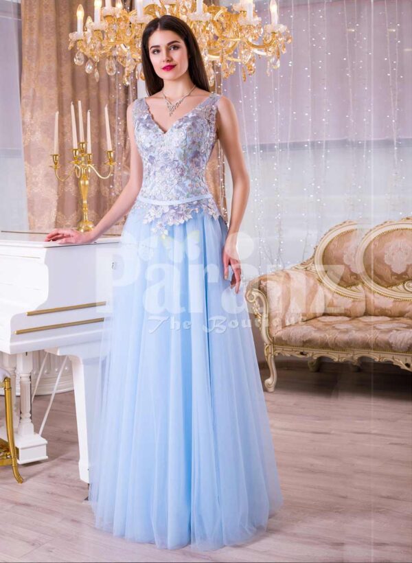 Womens sleeveless evening gown with floor length tulle skirt and flower appliquéd bodice