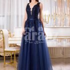 Womens sleeveless navy floor length gown with rich rhinestone studded bodice