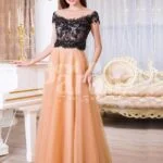 Womens stunning evening gown with lacy black bodice and long peach tulle skirt