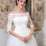 Womens tea length white lacy bodice and tulle skirt wedding gown