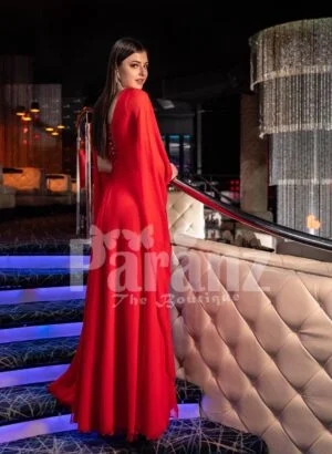 Womens vibrant red side slit tulle skirt gown with long frilly sleeves