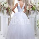 Women’s Barbie style pearl white sleeveless wedding gown with high volume tulle skirt back side view