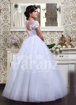 Women’s Cinderella style flared tulle skirt wedding gown with lace appliquéd royal bodice back side view