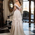 Women’s amazing side slit off-shoulder beige glitz wedding gown back side view