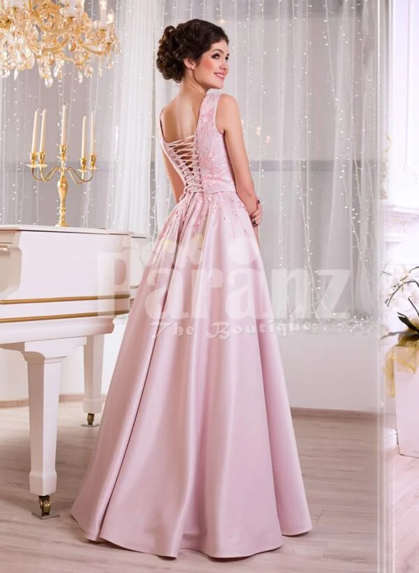 Women’s baby pink elegant evening gown with long satin skirt and sleeveless royal bodice side view