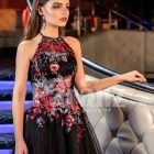 Women’s beautiful off-shoulder black tulle skirt gown with colorful floral appliquéd bodice