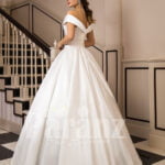 Women’s beautiful off-shoulder floor length rich satin gown with tulle skirt underneath back side view