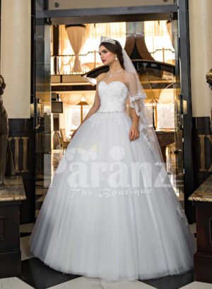 Women’s beautiful off-shoulder pearl white tulle wedding gown with floral bodice
