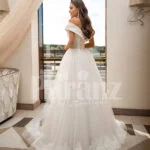 Women’s beautiful off-shoulder styled floor length tulle gown with glam bodice back side view