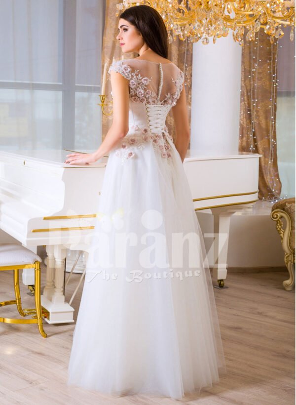 Women’s beautiful white and pink rosette bodice elegant floor length tulle gown back side view