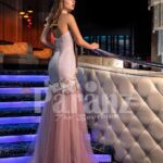 Women’s beige pink side slit flared tulle skirt gown with rich rhinestone bodice back side view