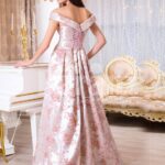 Women’s bright metal pink evening satin gown with pink rosette designs all over back side view