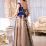 Women’s brown-grey floor length tulle skirt evening gown with bright floral appliquéd bodice back side view