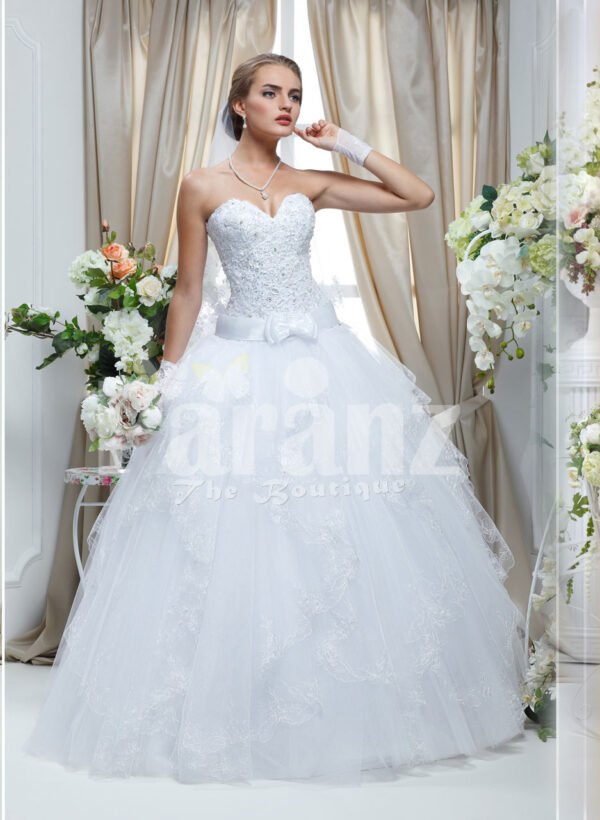 Women’s classy pearl white off-shoulder wedding gown with flared tulle skirt and royal bodice