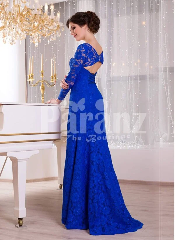 Women’s deep v cut floor length side slit satin evening gown with all over blue lace work side view