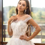 Women’s dreamy pearl white wedding tulle gown with royal bodice close view