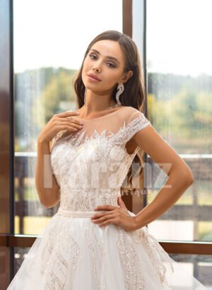 Women’s dreamy pearl white wedding tulle gown with royal bodice close view