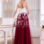 Women’s elegant contrast evening gown with maroon tulle skirt and white lacy bodice back side view