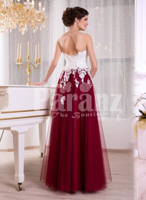 Women’s elegant contrast evening gown with maroon tulle skirt and white lacy bodice back side view