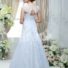 Women’s elegant floor length sleeveless white satin gown with all over white lace work back side view