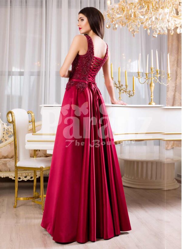Women’s elegant maroon floor length evening gown with tulle skirt and royal bodice back side view