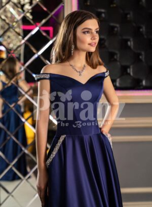Women’s elegant navy blue smooth satin evening gown with off-shoulder bodice