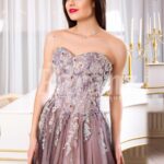 Women’s elegant off-shoulder evening gown with long tulle skirt and rich appliquéd bodice