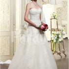Women’s elegant off-shoulder style wedding gown with flared and high volume tulle skirt