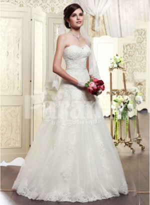 Women’s elegant off-shoulder style wedding gown with flared and high volume tulle skirt