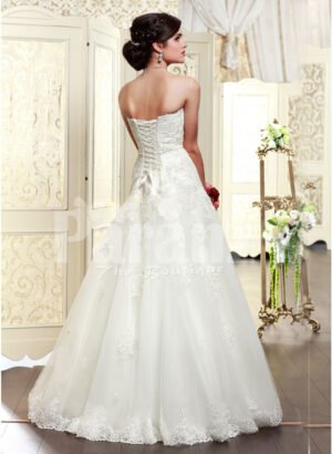 Women’s elegant off-shoulder style wedding gown with flared and high volume tulle skirt back side view