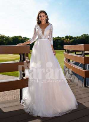 Women’s elegant pearl white tulle wedding gown with royal bodice three quarter sleeves